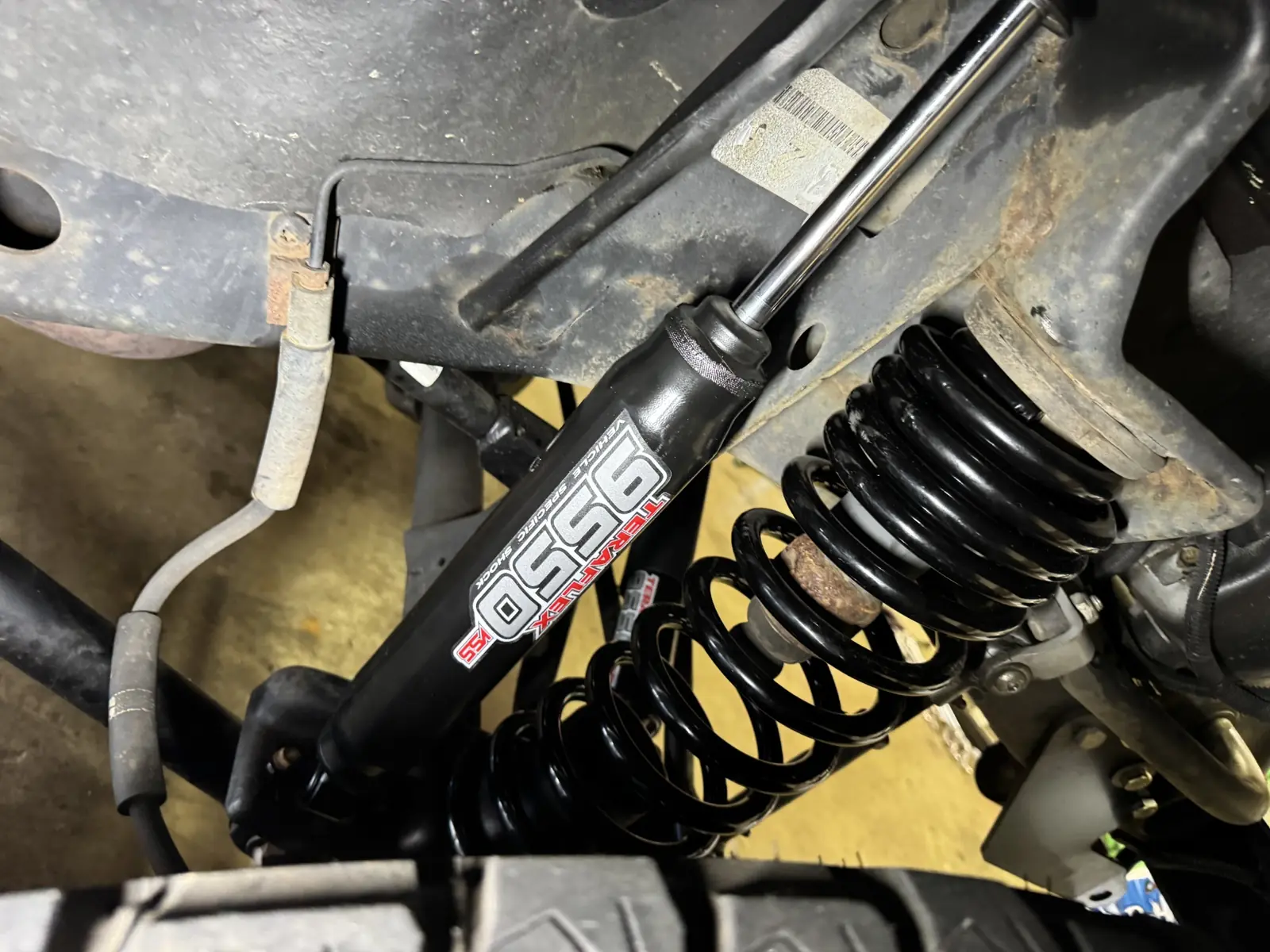 Lift spring and shock installed on a 2008 Jeep Wrangler.