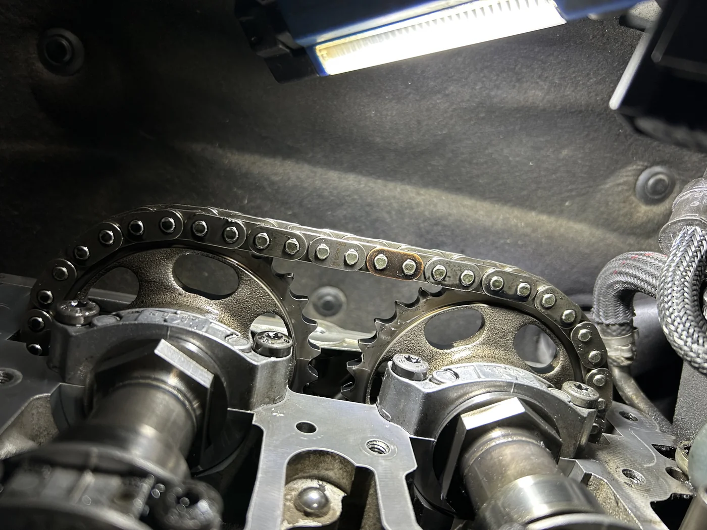 Exposed timing chain and camshaft sprockets on a 2016 Mercedes-Benz Sprinter 2500.