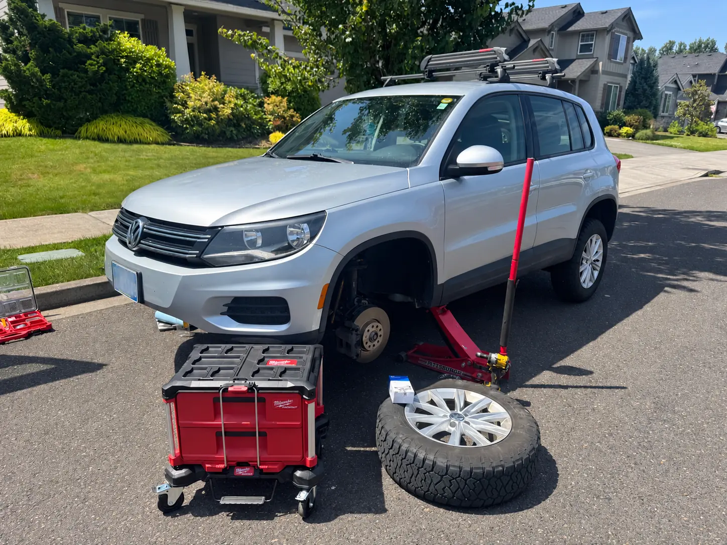 2017 Volkswagen Tiguan raised for mobile suspension and steering repair.
