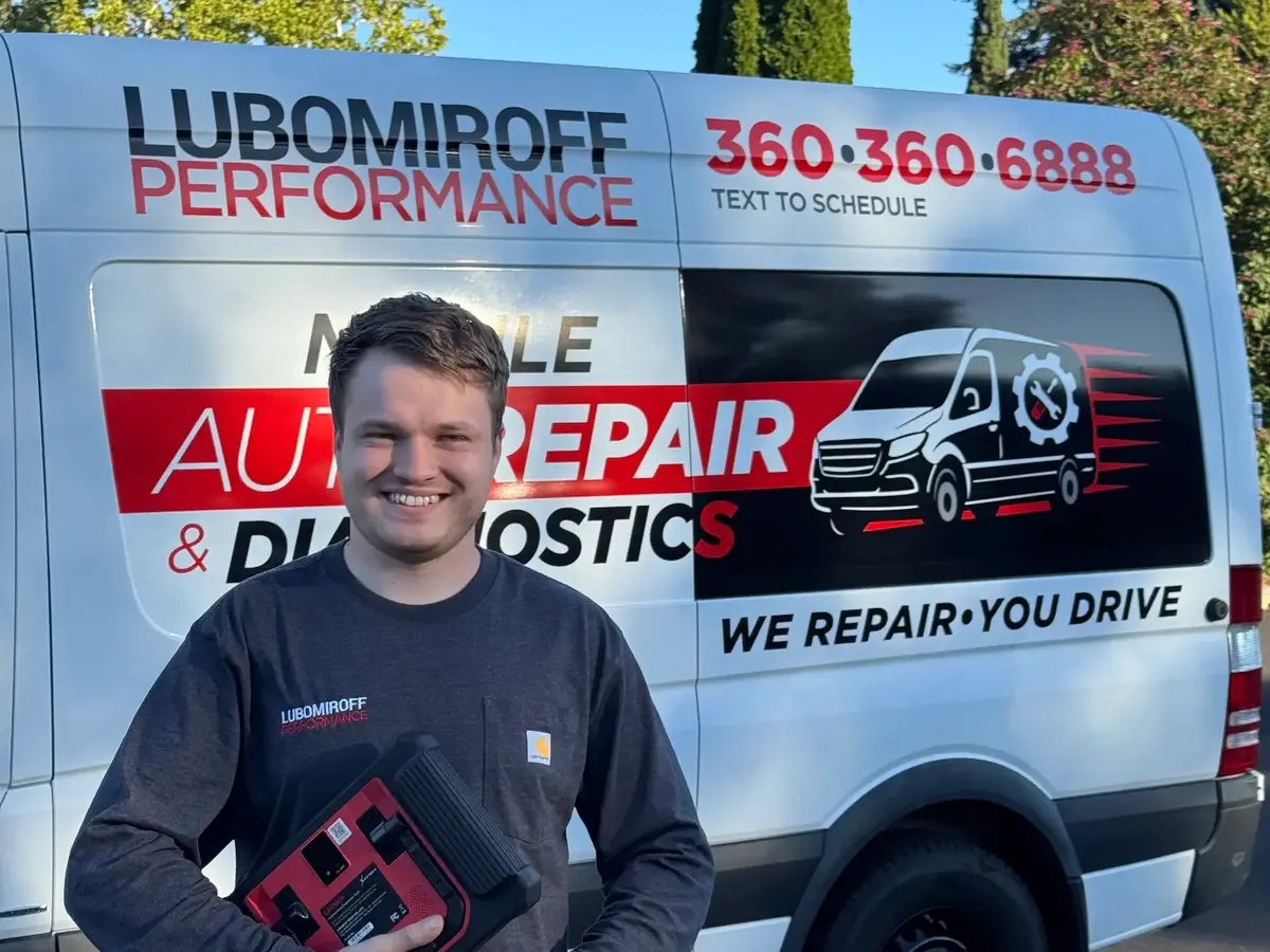 Alex beside the Lubomiroff Performance mobile service van in Vancouver, Washington