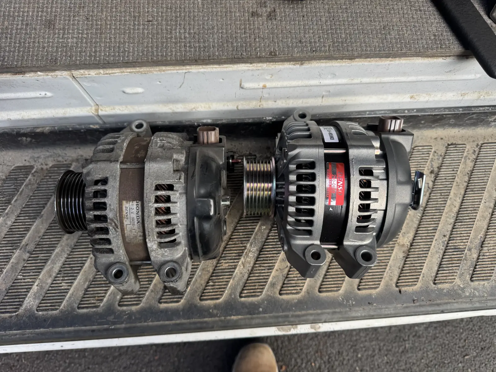 Old and replacement alternators for a 2009 Honda CR-V.