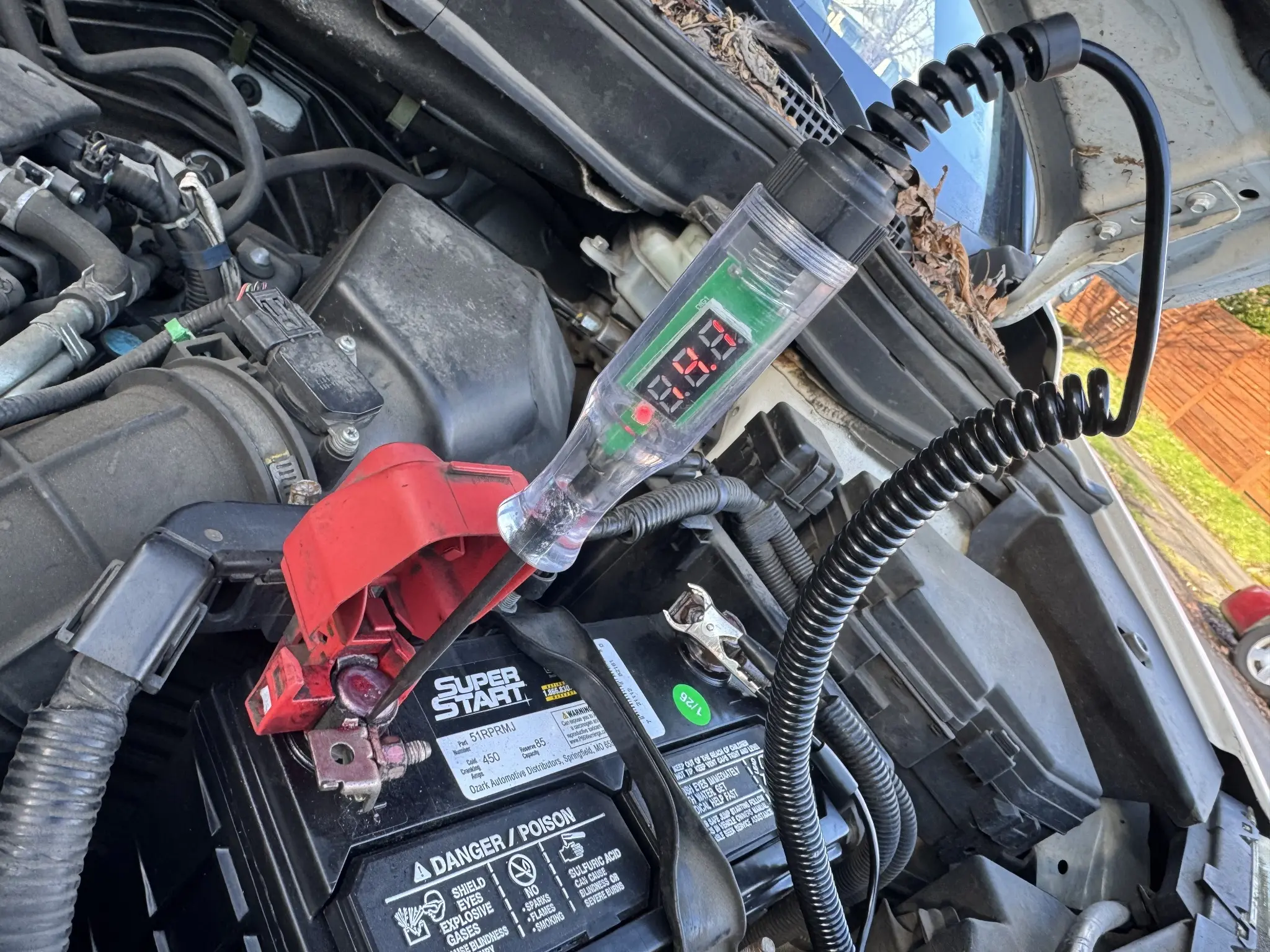 Charging-system test during a mobile auto electrical repair.