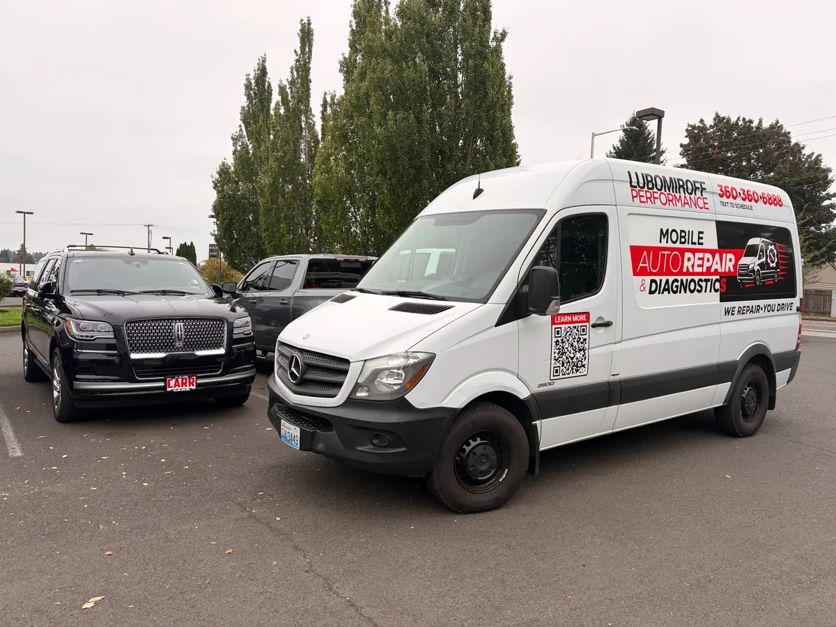 Lubomiroff Performance mobile service van beside a vehicle during an on-site pre-purchase inspection.