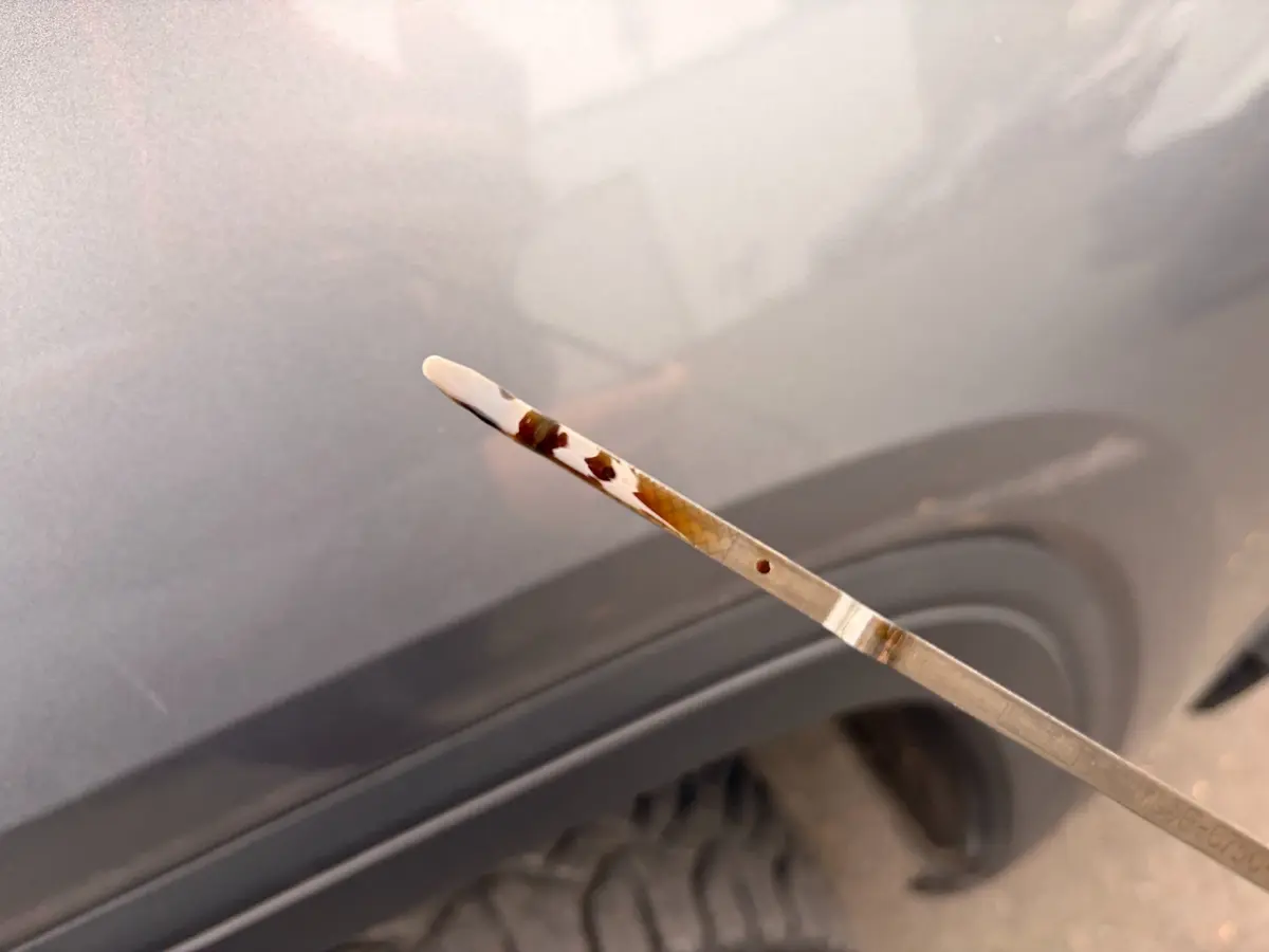 Very dark engine oil found during the Lincoln Navigator inspection.